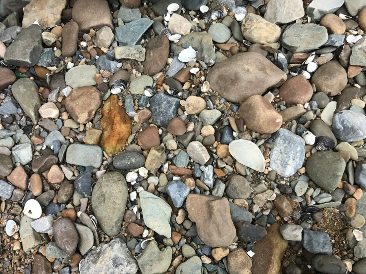 some sort of rock with rocks and stones surrounding it