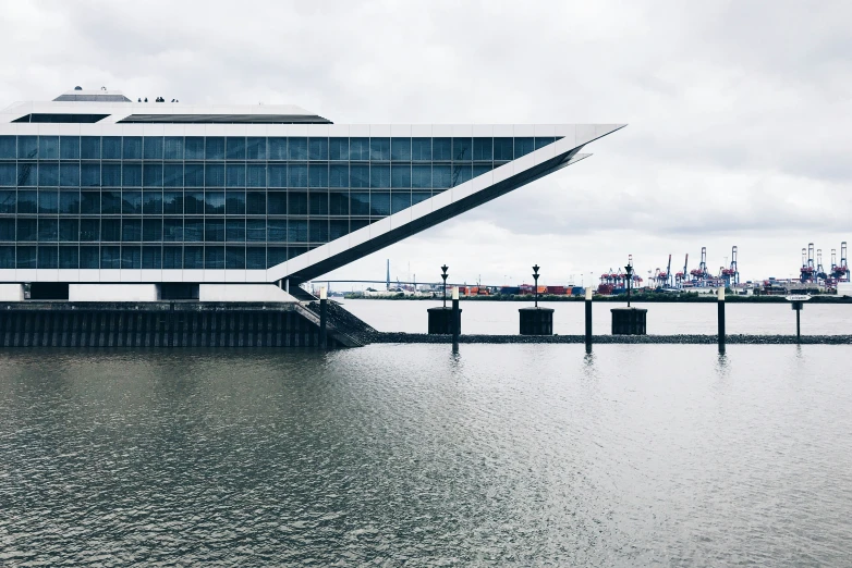 a body of water with a building next to it