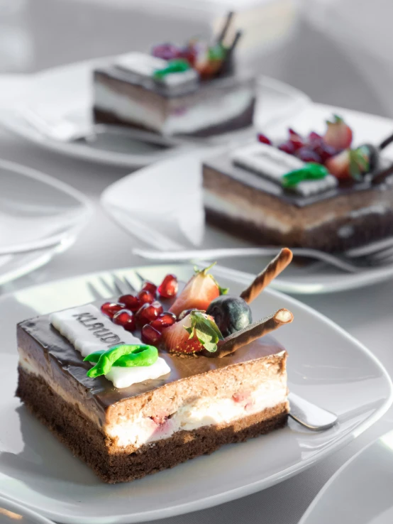 slices of cheesecake with fruit arranged on plates