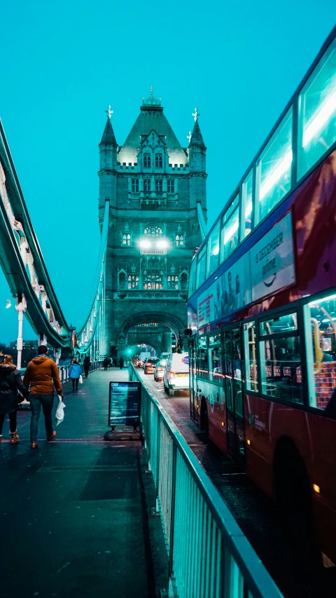 a bus is moving in front of the big ben bridge