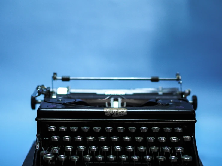 an old typewriter is sitting on a table