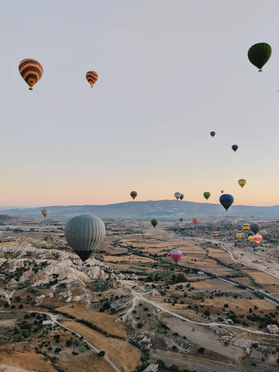 many  air balloons flying high in the sky