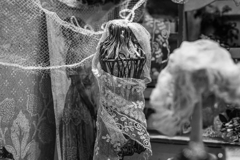 a dress hangs on a fence at night