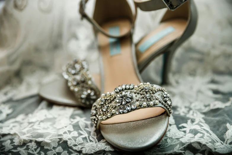 an elegant silver shoe with matching jewels