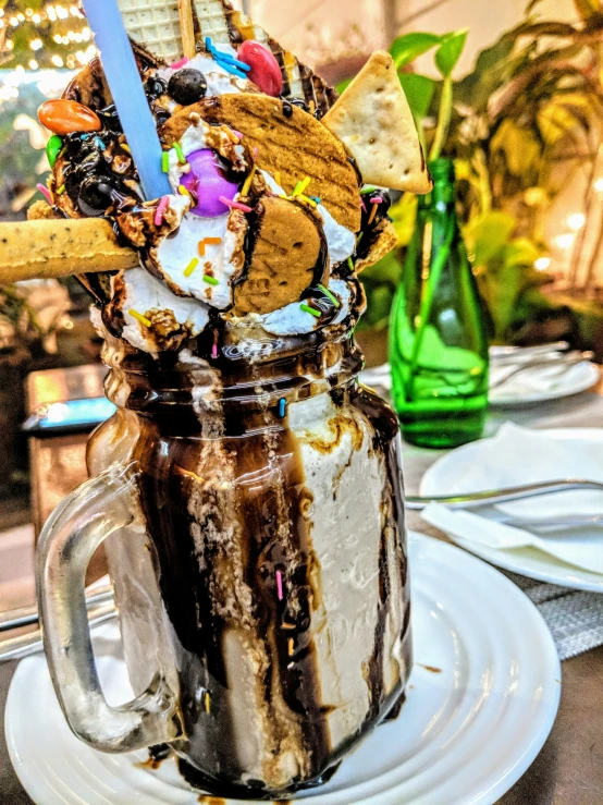 chocolate ice cream, cookies and candy in a jar