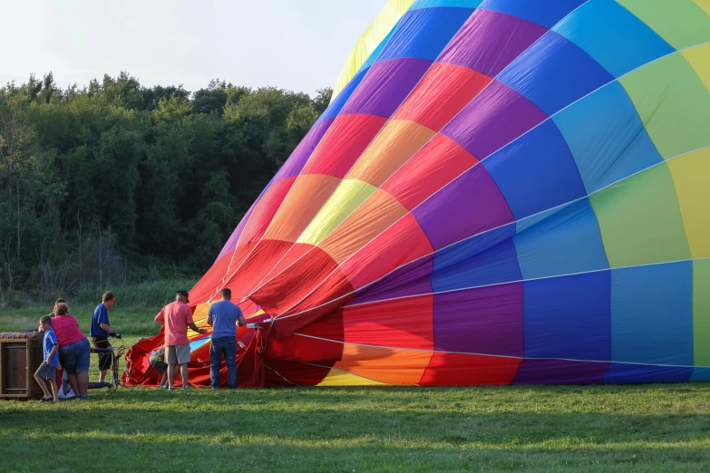 there are people waiting to fly in a  air balloon