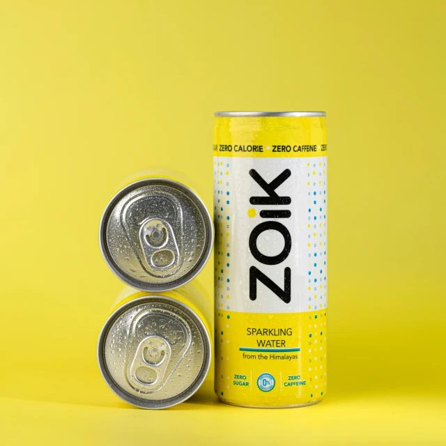 a can and two cans of canned soda
