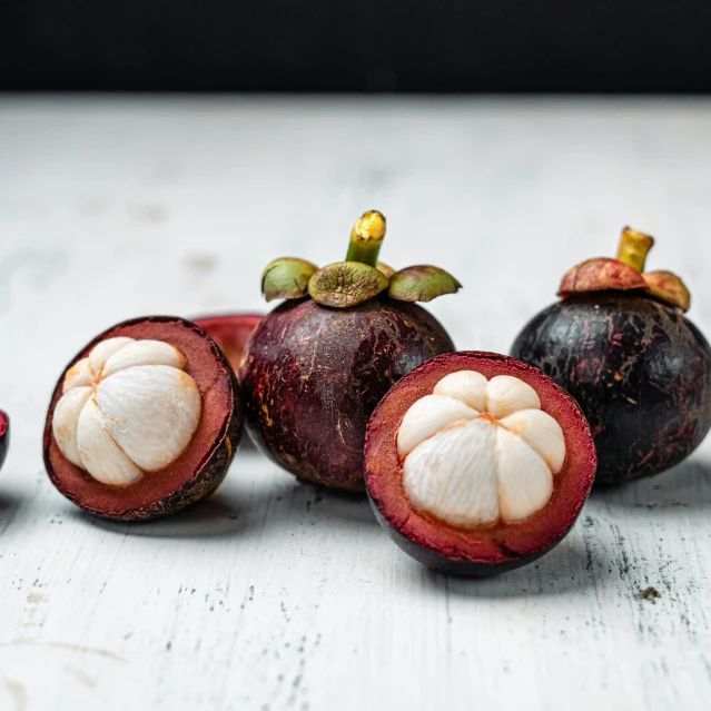 three pieces of fruit are shown next to one another