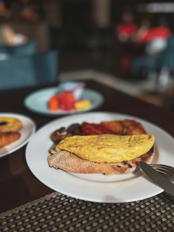 two plates with food on them sit on a table