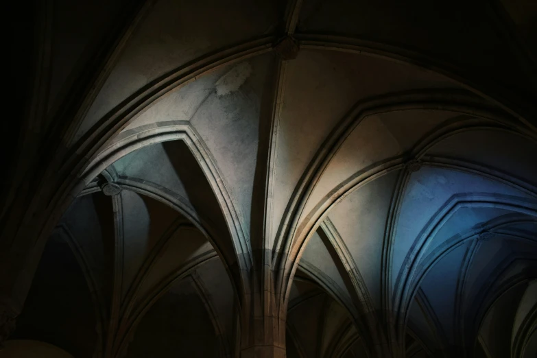 two dark arches in an interior of a building