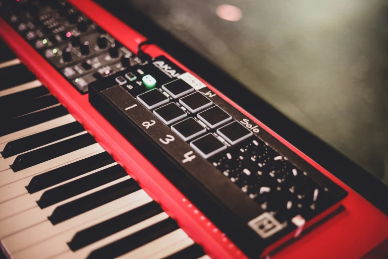 a red keyboard sitting on top of a table