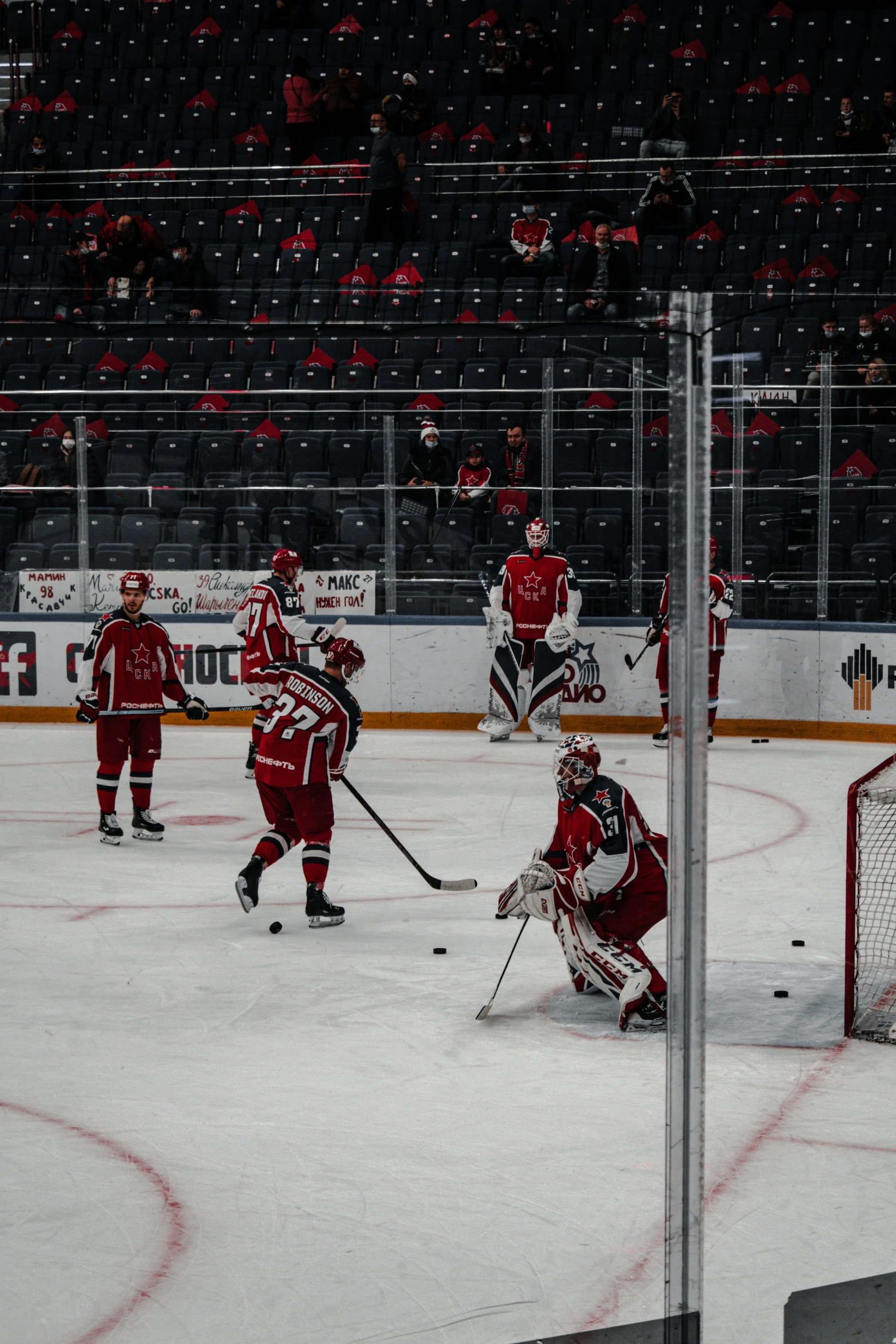 some hockey players are playing in a hockey arena