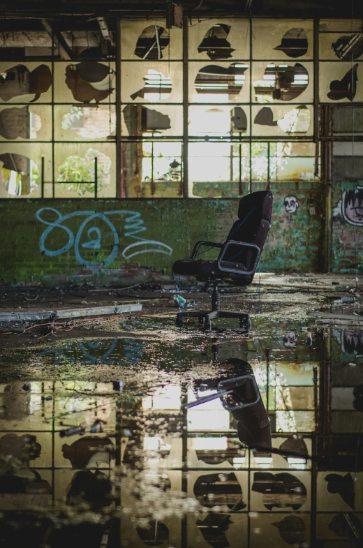a chair sits on a flooded area in a warehouse