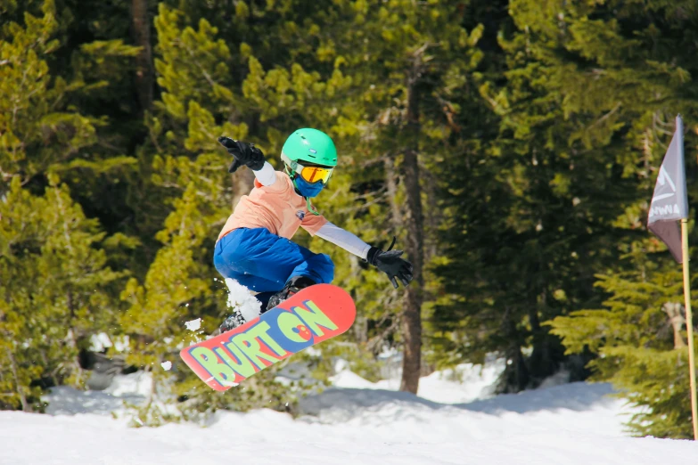 the snowboarder is in midair doing a trick