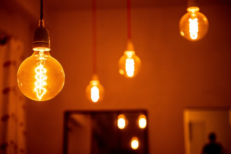 light bulbs in a dark room on wall