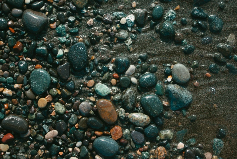 many small rocks and stones are laying on the ground