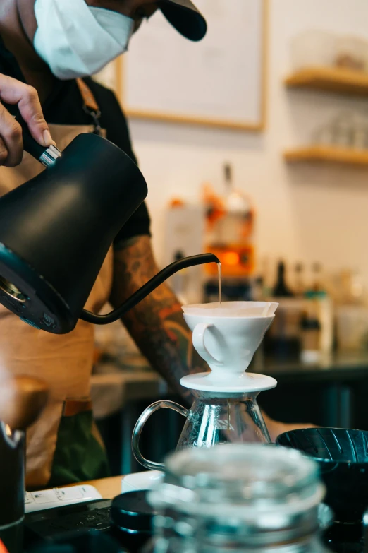 the coffee is being poured into the cup of a coffee machine