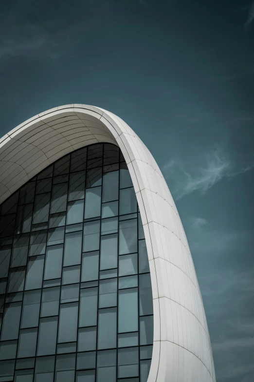 a large circular building with some windows at the top