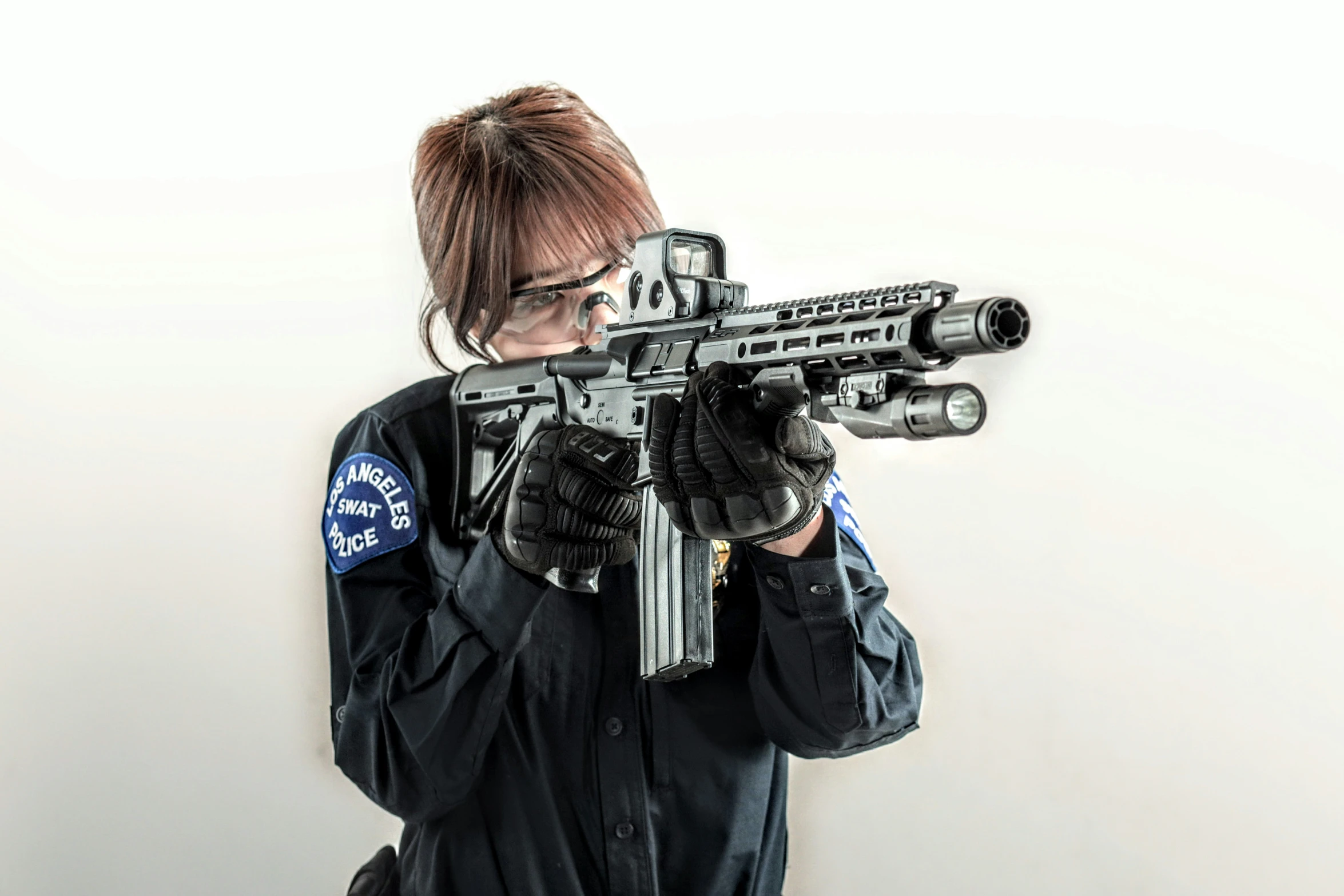 a woman holding up a gun like a futuristic shooter