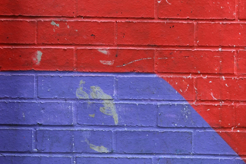 the red, blue, and yellow side of a brick building