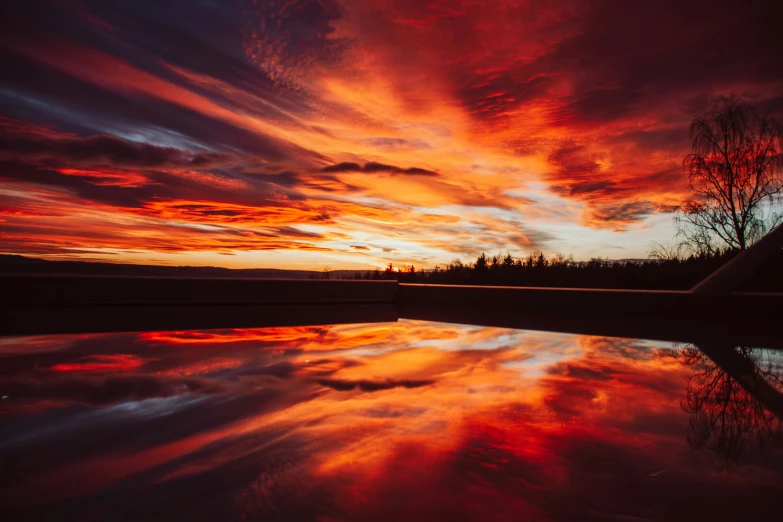 the sky is colored in red and orange