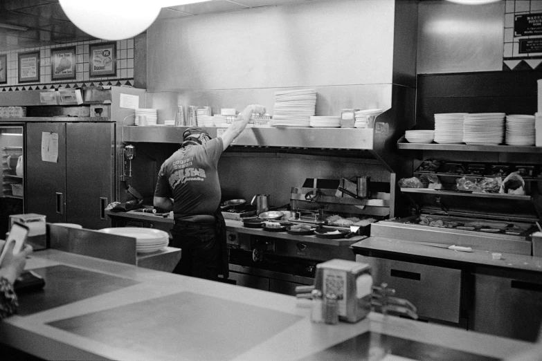 a restaurant kitchen has many dishes being prepared