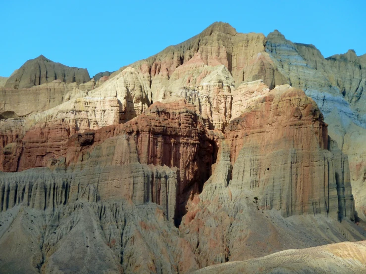 a mountain range is shown with trees growing on it