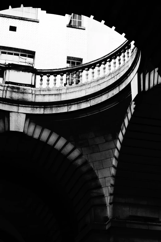 black and white pograph of a curved bridge