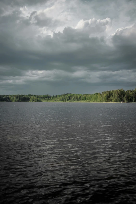 a cloudy sky over a calm ocean