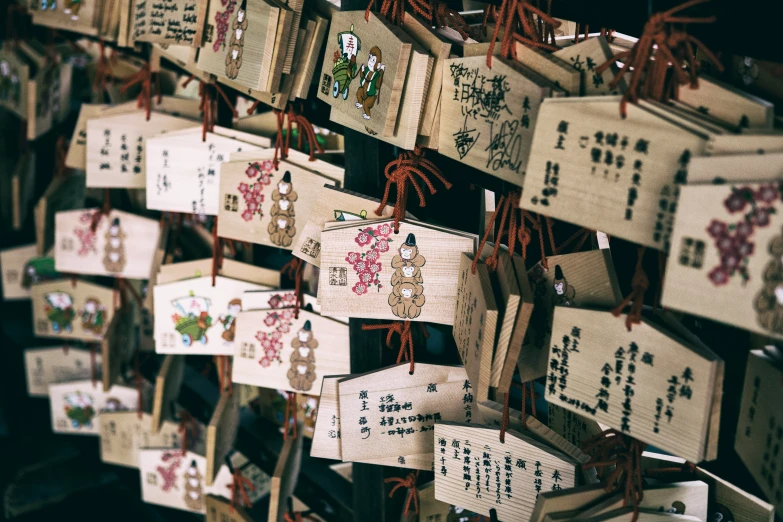 many small decorations are hung from a wall