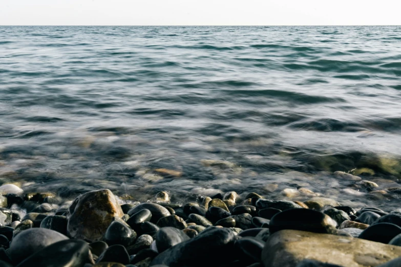 some rocks and water in the middle of the ocean