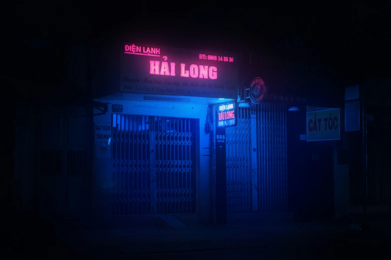 a store front with the neon light at night