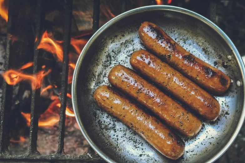 sausages are cooked on the grill, ready to eat