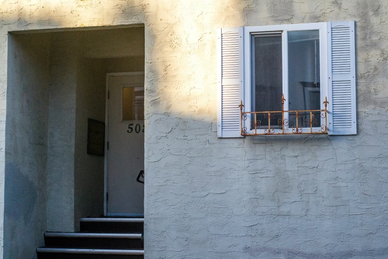 a house that has shutters and windows