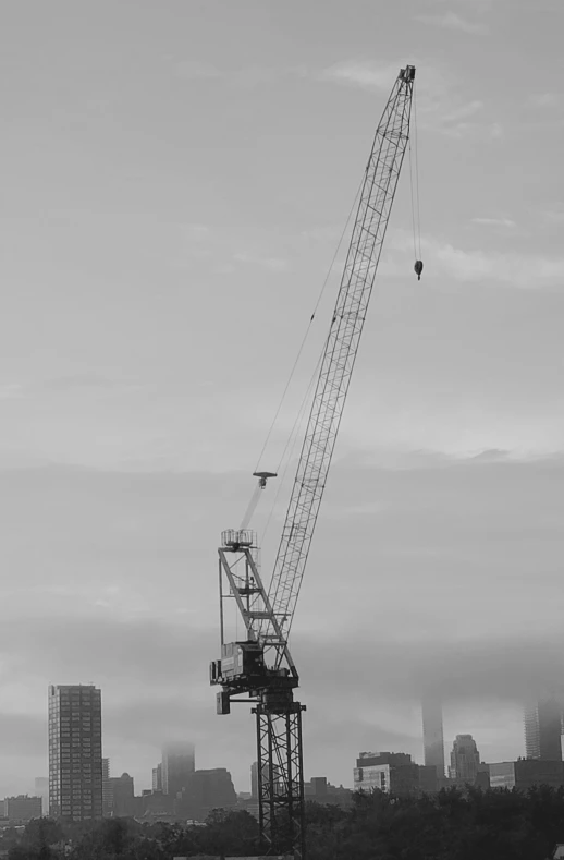 crane working on a skyscr overlooking the city