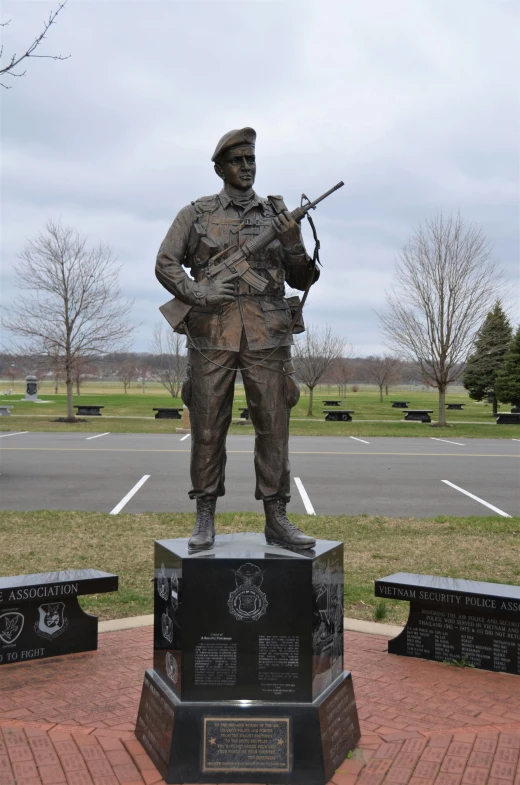 a statue of a soldier holding a rifle