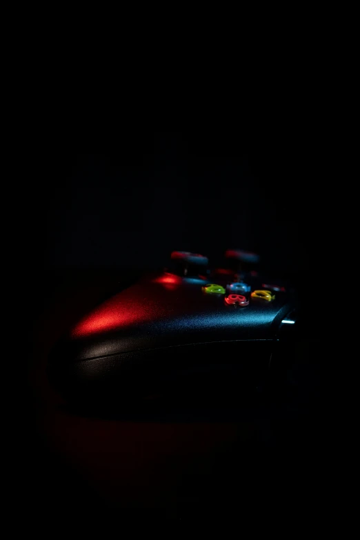 a controller sitting in the middle of a dark room