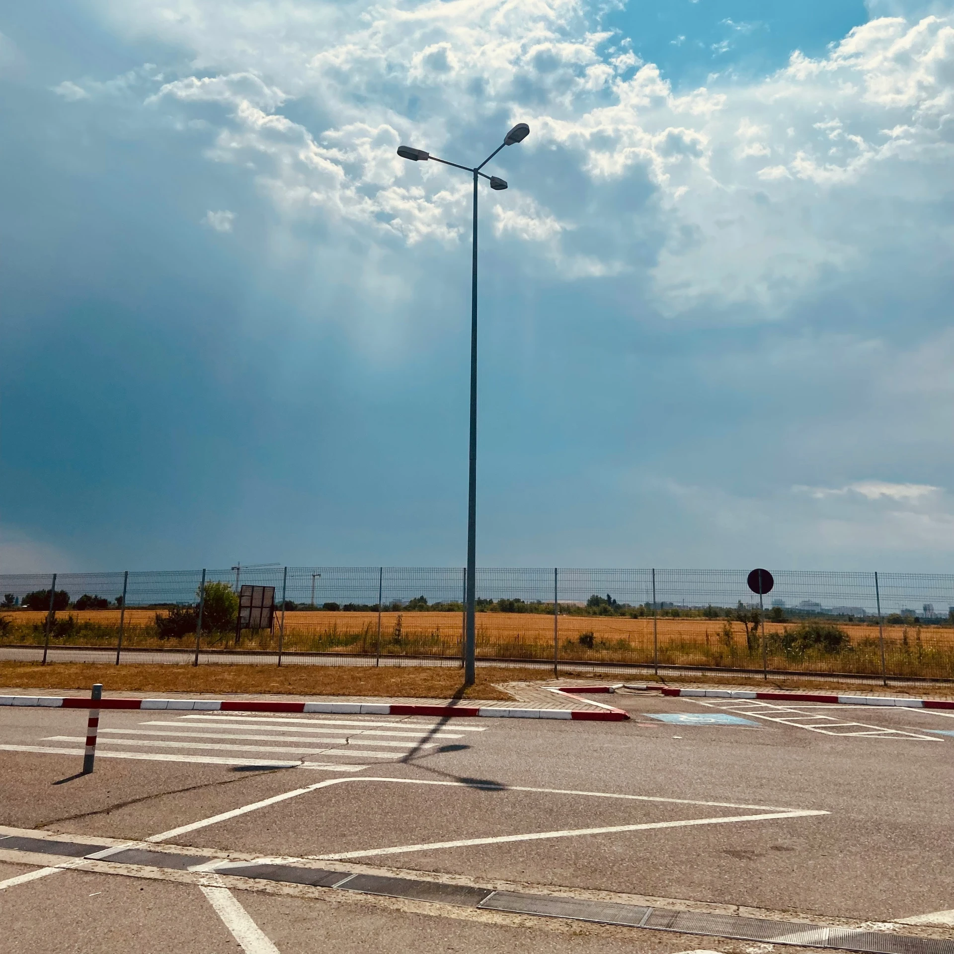 a deserted parking lot in a country road