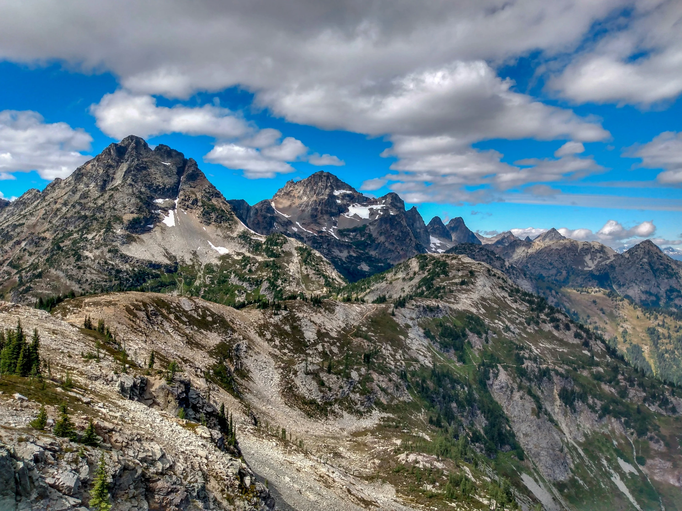 there are a few mountain tops in the sky