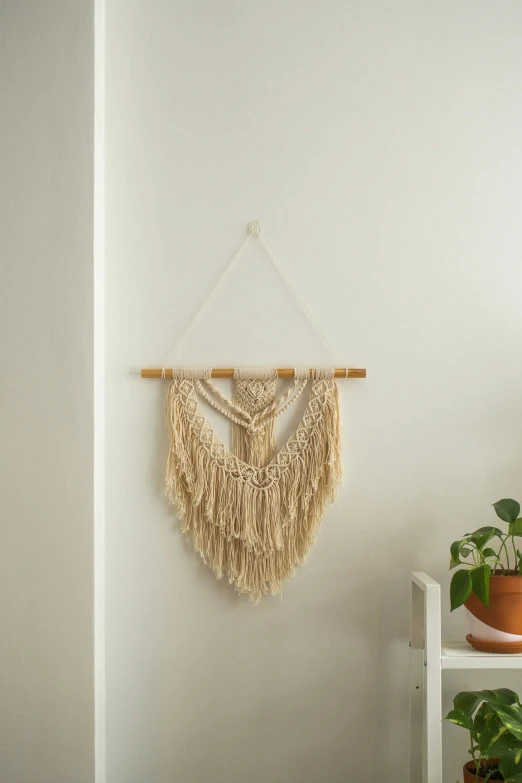 a macrame hanging from a wall in a living room