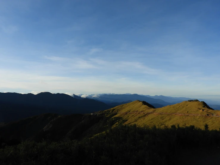 a mountain with a bench sitting on top of it