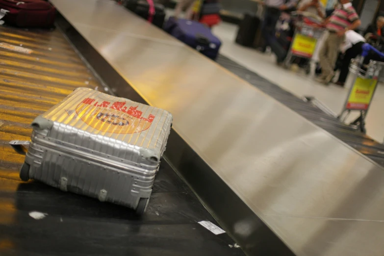 a couple suitcases on top of a conveyor belt at the airport