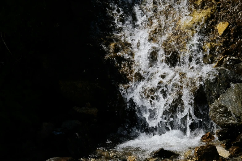 a waterfall is seen close to the camera