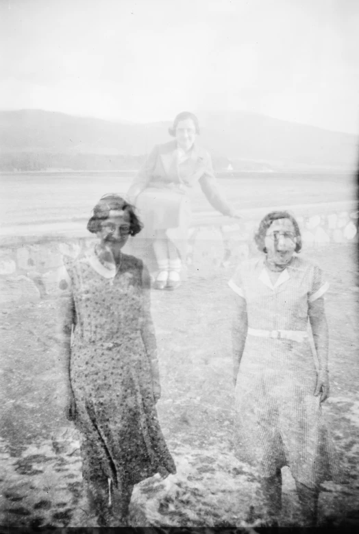 vintage black and white image of two women walking