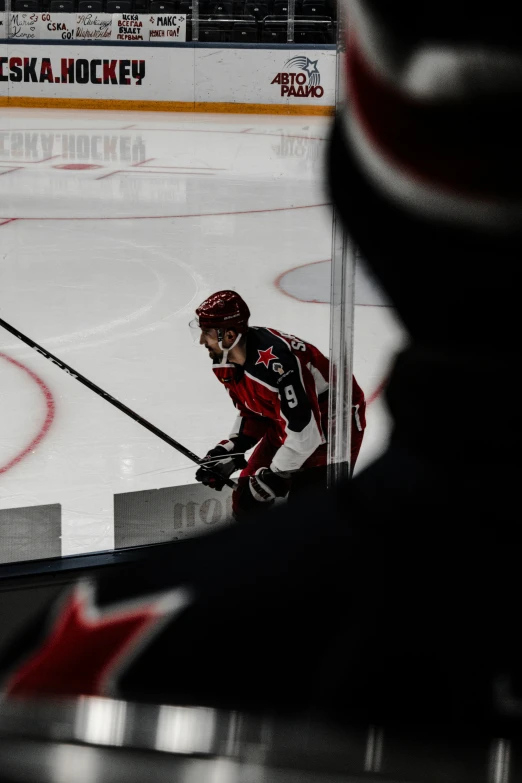 a person on a skate rink waiting for the puck