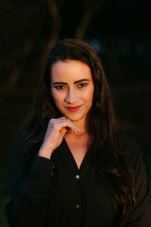 a woman is posing for the camera and looking at the camera