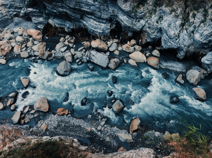 a river that has some rocks and water