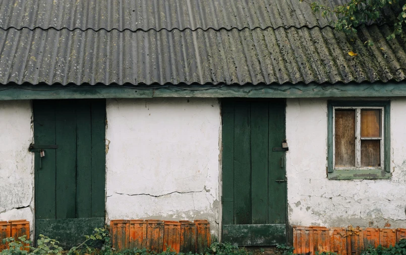 a house with a window and green door