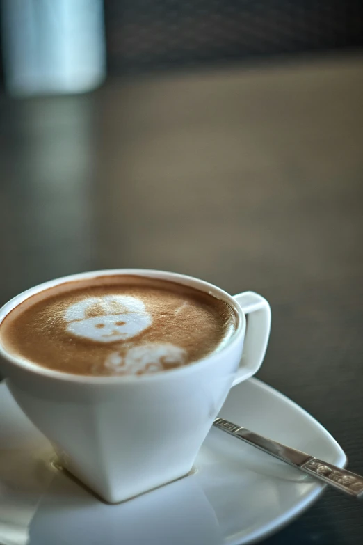 a cup of coffee that is on a saucer