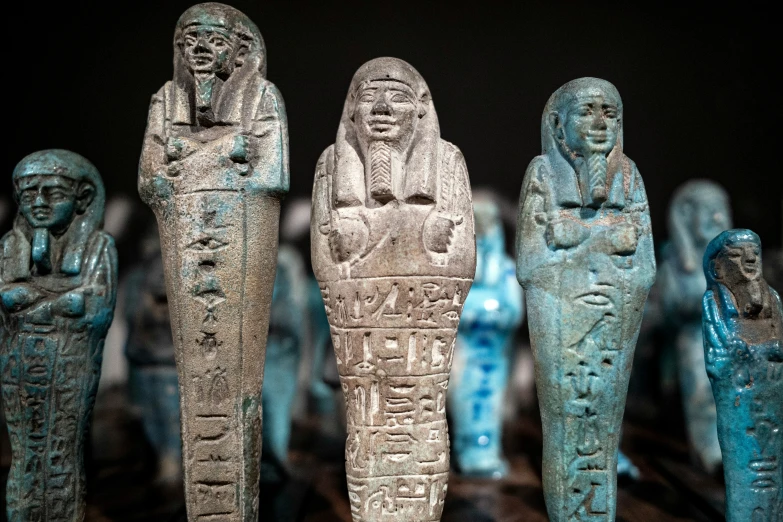 several egyptian artifacts are displayed in front of an image